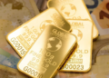 Gold near two-week high as weak dollar and easing Iran tensions support prices